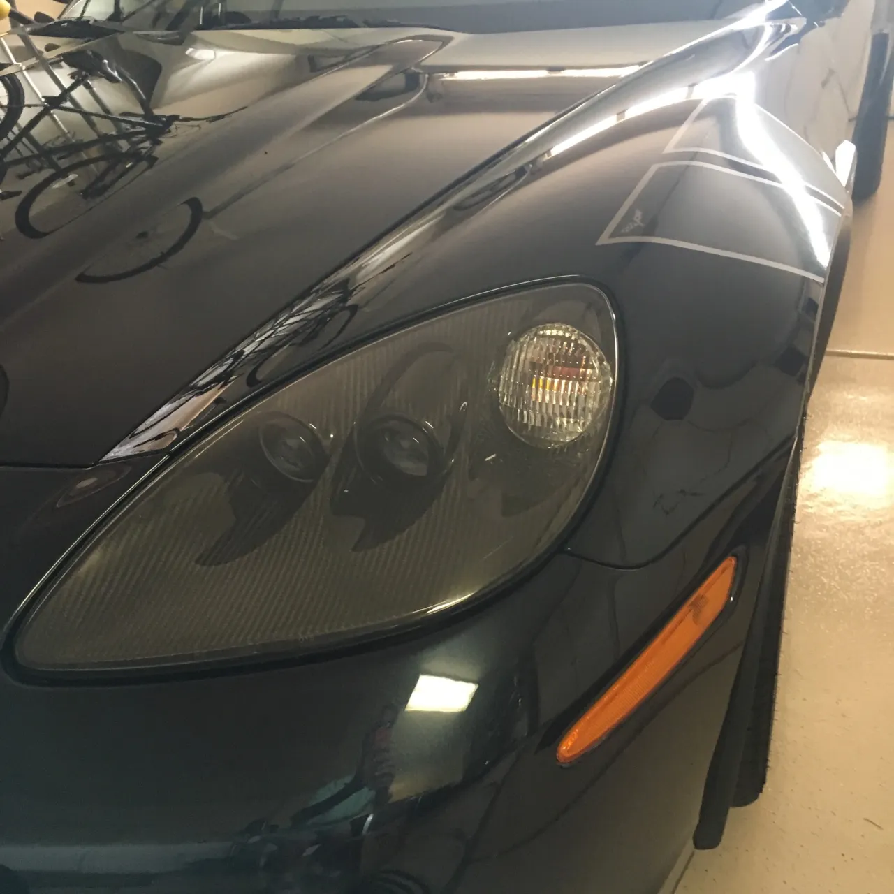 Red C6 Corvette with restored headlights
