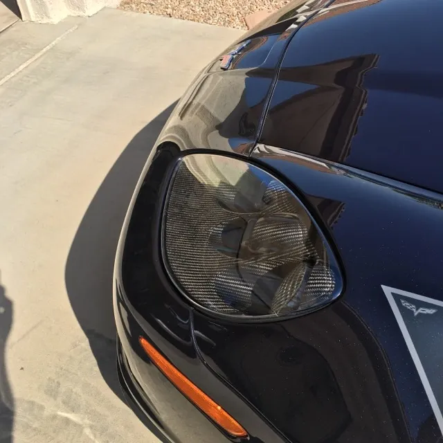 Black C6 Corvette with halo headlights
