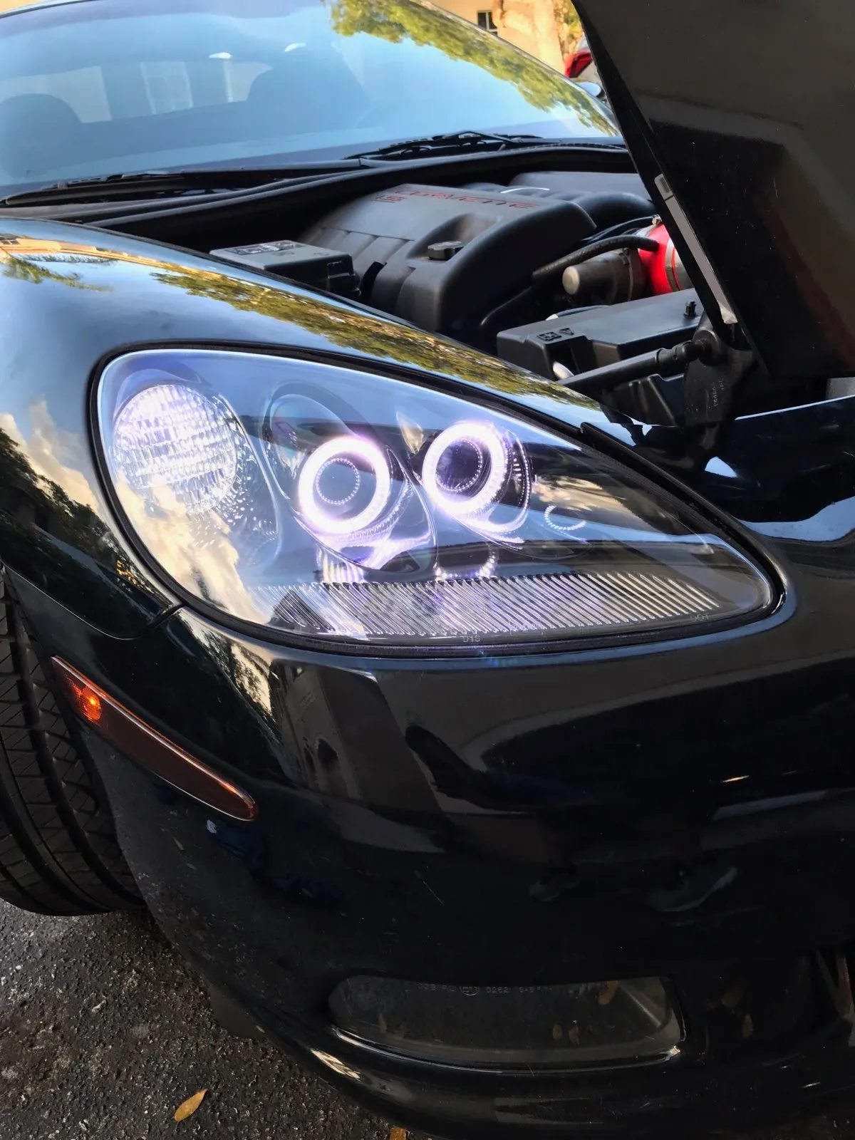 Carbon fiber headlight on black Corvette