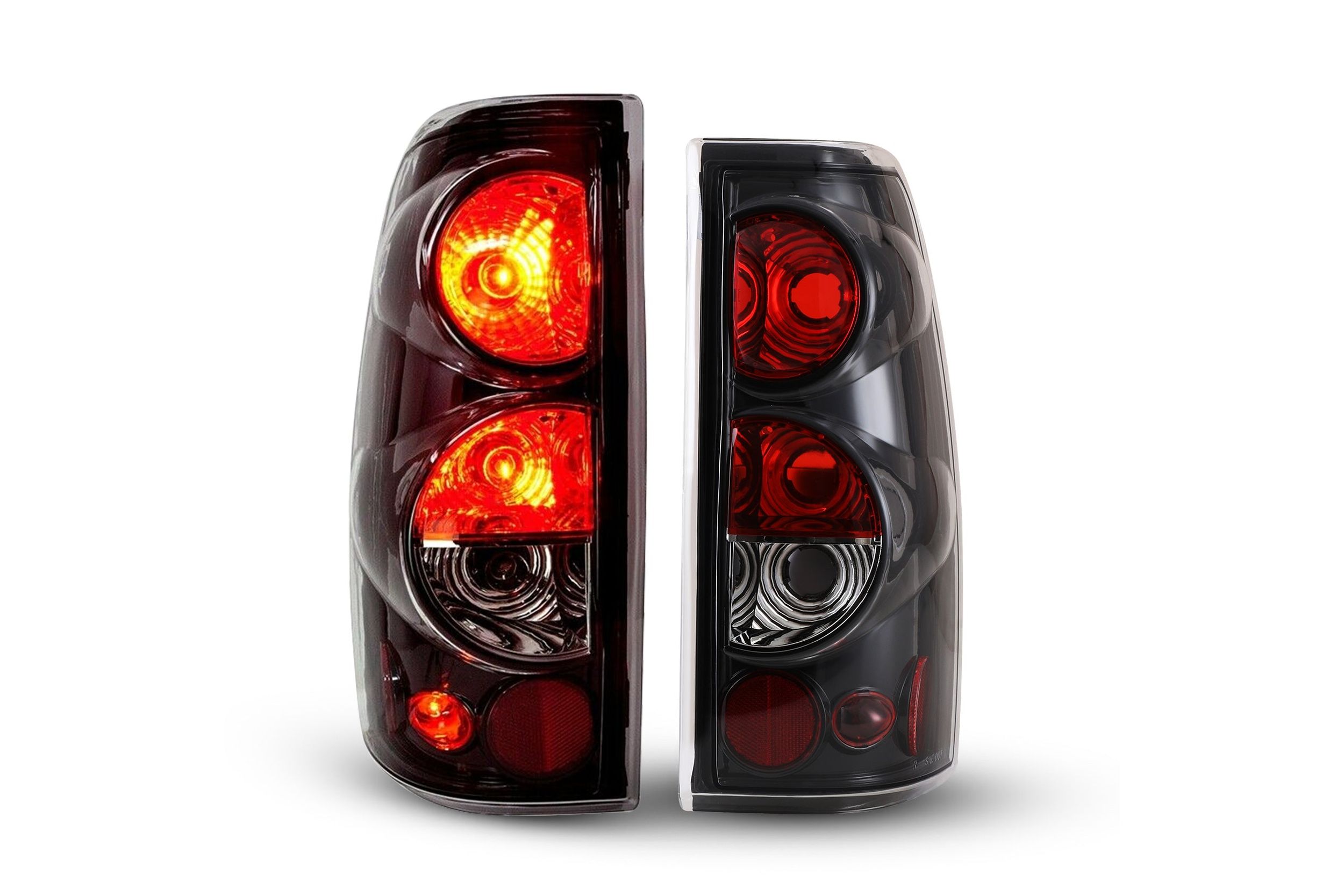 99-03 GMC Sierra: Winjet Altezza Tail Lights - Gloss Black/Clear